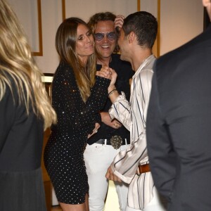 Heidi Klum, Peter Dundas et Evangelo Bousis à la soirée d'ouverture de la marque de vêtements Dundas à West Hollywood, le 24 avril 2018.