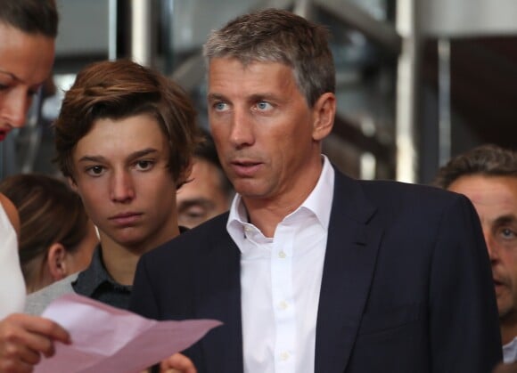 Stéphane Courbit et son fils - People assistent au match de football entre le PSG et Saint-Etienne au parc des Princes à Paris le 31 aout 2014.