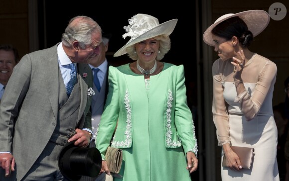 Le prince Charles, prince de Galles, Camilla Parker Bowles, duchesse de Cornouailles, Meghan Markle, duchesse de Sussex lors de la garden party pour les 70 ans du prince Charles au palais de Buckingham à Londres. Le 22 mai 2018