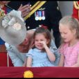 Kate Catherine Middleton, duchesse de Cambridge, console sa fille, la princesse Charlotte - Les membres de la famille royale britannique lors du rassemblement militaire "Trooping the Colour" (le "salut aux couleurs"), célébrant l'anniversaire officiel du souverain britannique. Cette parade a lieu à Horse Guards Parade, chaque année au cours du deuxième samedi du mois de juin. Londres, le 9 juin 2018.
