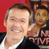 Jean-Luc Reichmann pose devant l'affiche du film "Nuit d'ivresse" à Paris le 9 janvier 201809/01/2018 - Paris