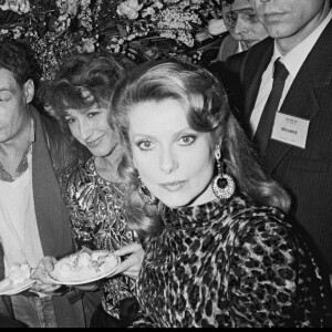 ARCHIVES - Philippe Léotard et Nathalie Baye avec Catherine Deneuve après les César 1983 à Paris