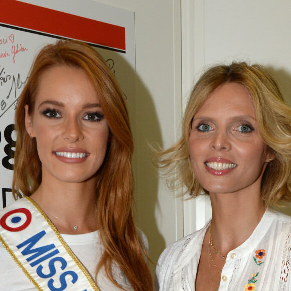 Maëva Coucke (Miss France 2018) et Sylvie Tellier (directrice générale de la Société Miss France et Miss France 2002) lors de la 14e édition du Charity Day dans la salle des marchés de la société de courtage Aurel BGC au profit des 7 associations participantes à Paris, le 11 septembre 2018. © Veeren/Bestimage