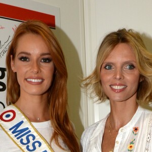 Maëva Coucke (Miss France 2018) et Sylvie Tellier (directrice générale de la Société Miss France et Miss France 2002) lors de la 14e édition du Charity Day dans la salle des marchés de la société de courtage Aurel BGC au profit des 7 associations participantes à Paris, le 11 septembre 2018. © Veeren/Bestimage