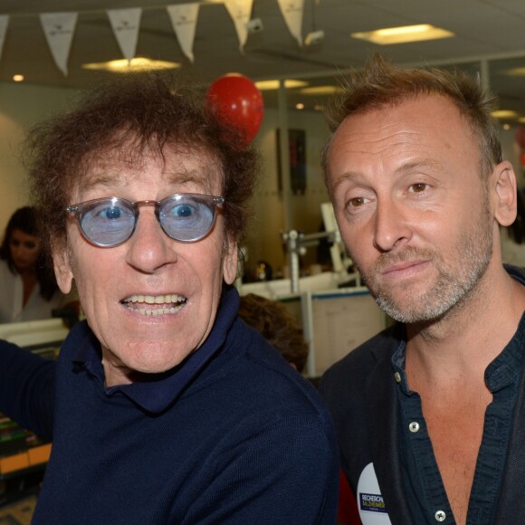 Alain Souchon et son fils Pierre lors de la 14e édition du Charity Day dans la salle des marchés de la société de courtage Aurel BGC au profit des 7 associations participantes à Paris, le 11 septembre 2018. © Veeren/Bestimage