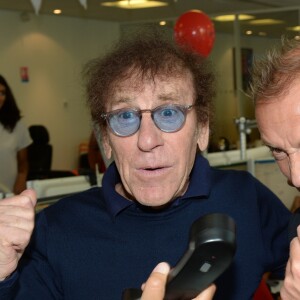 Alain Souchon et son fils Pierre lors de la 14e édition du Charity Day dans la salle des marchés de la société de courtage Aurel BGC au profit des 7 associations participantes à Paris, le 11 septembre 2018. © Veeren/Bestimage