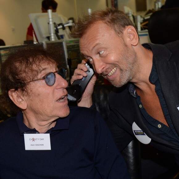 Alain Souchon et son fils Pierre lors de la 14e édition du Charity Day dans la salle des marchés de la société de courtage Aurel BGC au profit des 7 associations participantes à Paris, le 11 septembre 2018. © Veeren/Bestimage