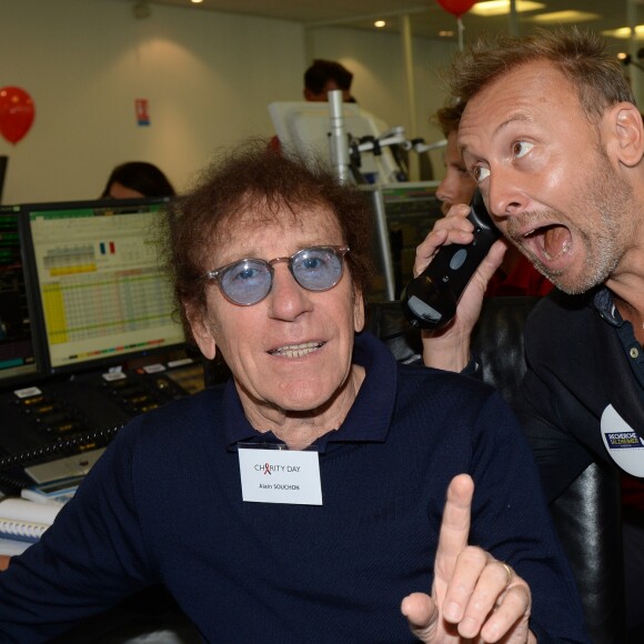 Alain Souchon et son fils Pierre lors de la 14e édition du Charity Day dans la salle des marchés de la société de courtage Aurel BGC au profit des 7 associations participantes à Paris, le 11 septembre 2018. © Veeren/Bestimage