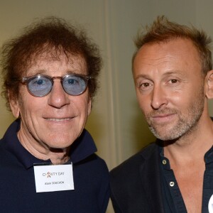 Alain Souchon et son fils Pierre lors de la 14e édition du Charity Day dans la salle des marchés de la société de courtage Aurel BGC au profit des 7 associations participantes à Paris, le 11 septembre 2018. © Veeren/Bestimage