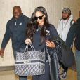 Exclusif - Rihanna porte un sac Christian Dior à son nom à son arrivée à l'aéroport de JFK à New York, le 12 septembre 2018.
