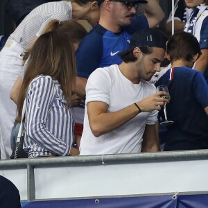 Claire Francisci, Iris Mittenaere (Miss France, Miss Univers 2016 et Danse avec les Stars 2018) et son partenaire de danse Anthony Colette dans les tribunes du stade de France lors du match de ligue des nations opposant la France à l'Allemagne à Saint-Denis, Seine Saint-Denis, France, le 16 octobre 2018.