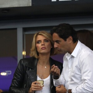 Sylvie Tellier (directrice générale de la Société Miss France et Miss France 2002) et son mari Laurent dans les tribunes du stade de France lors du match de ligue des nations opposant la France à l'Allemagne à Saint-Denis, Seine Saint-Denis, France, le 16 octobre 2018.