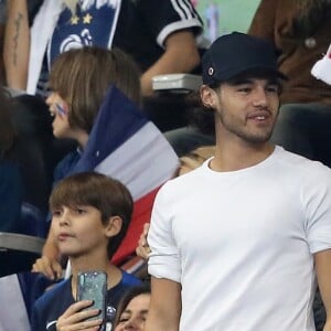 Iris Mittenaere (Miss France, Miss Univers 2016 et Danse avec les Stars 2018) et son partenaire de danse Anthony Colette dans les tribunes du stade de France lors du match de ligue des nations opposant la France à l'Allemagne à Saint-Denis, Seine Saint-Denis, France, le 16 octobre 2018.