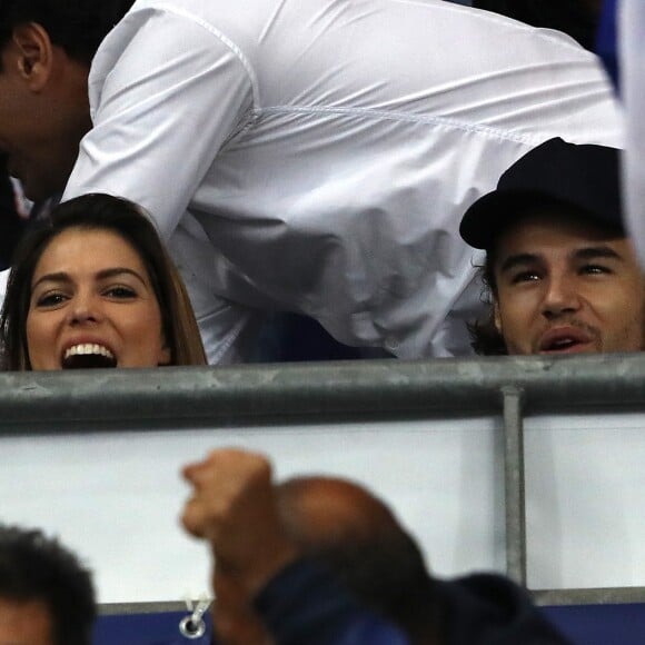 Iris Mittenaere (Miss France, Miss Univers 2016 et Danse avec les Stars 2018) et son partenaire de danse Anthony Colette dans les tribunes du stade de France lors du match de ligue des nations opposant la France à l'Allemagne à Saint-Denis, Seine Saint-Denis, France, le 16 octobre 2018.