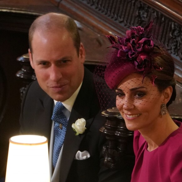 Le prince William, duc de Cambridge, la duchesse Catherine de Cambridge, le prince Harry, duc de Sussex, et la duchesse Meghan de Sussex lors du mariage de la princesse Eugenie d'York et Jack Brooksbank en la chapelle Saint-George au château de Windsor, le 12 octobre 2018.