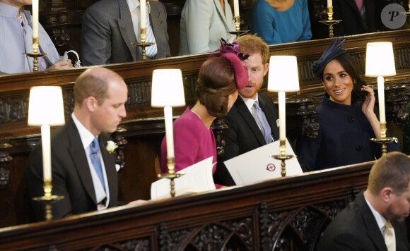 Le prince William, duc de Cambridge, la duchesse Catherine de Cambridge, le prince Harry, duc de Sussex, et la duchesse Meghan de Sussex lors du mariage de la princesse Eugenie d'York et Jack Brooksbank en la chapelle Saint-George au château de Windsor, le 12 octobre 2018.