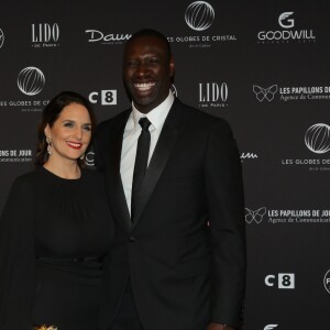 Omar Sy et sa femme Hélène au photocall de la 11ème cérémonie des Globes de Cristal au Lido à Paris le 30 janvier 2017. © CVS / Bestimage