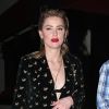 Exclusif - Amber Heard sort d'un restaurant à Beverly Hills le 18 décembre 2018. Elle porte un ensemble veste pantalon noir très sexy et décolleté sur un soutien gorge apparent noi
