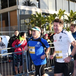 Christian Estrosi, le maire de Nice, et sa femme Laura Tenoudji participent à la 20eme édition de la Prom'Classic, une course à pied de 10kms sur la Promenade des Anglais à Nice le 6 janvier 2019. © Bruno Bebert / Bestimage