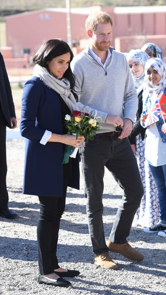 Le prince Harry, duc de Sussex et Meghan Markle (enceinte), duchesse de Sussex en visite dans un pensionnat à Asli lors de leur voyage officiel au Maroc. Le 24 février 2019