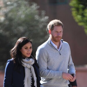 Le prince Harry, duc de Sussex et Meghan Markle (enceinte), duchesse de Sussex en visite dans un pensionnat à Asli lors de leur voyage officiel au Maroc. Le 24 février 2019