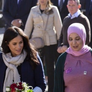 Le prince Harry, duc de Sussex, et Meghan Markle, duchesse de Sussex, enceinte, visitent un pensionnat de jeunes filles à Asni dans le cadre de leur voyage officiel au Maroc, le 24 février 2019.