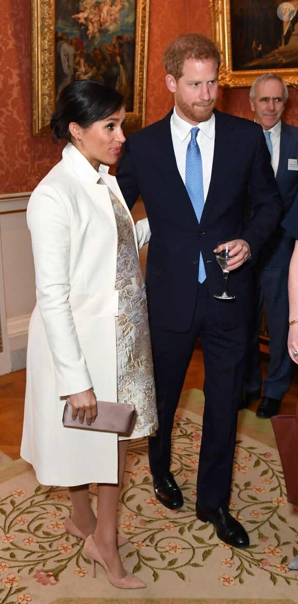 Le prince Harry, duc de Sussex, et Meghan Markle (enceinte), duchesse de Sussex - La famille royale d'Angleterre lors de la réception pour les 50 ans de l'investiture du prince de Galles au palais Buckingham à Londres. Le 5 mars 2019