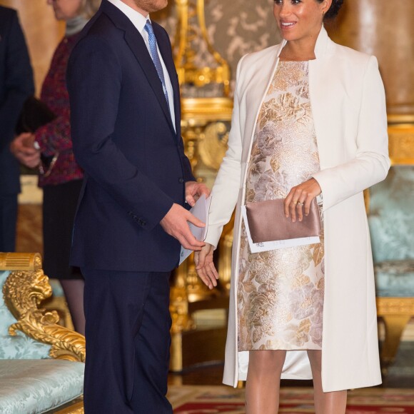 Le prince Harry, duc de Sussex, et Meghan Markle (enceinte), duchesse de Sussex - La famille royale d'Angleterre lors de la réception pour les 50 ans de l'investiture du prince de Galles au palais Buckingham à Londres. Le 5 mars 2019