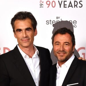 Raphaël Enthoven et Bernard Montiel - "Grace Kelly 90 Years", exposition hommage à la princesse Grace de Monaco pour le 90ème anniversaire de sa naissance au Musée des Colections des voitures princières à Monaco le 18 avril 2019. L'artiste plasticien niçois Stéphane Bolongaro a investi le Musée des Colections des voitures princières à Fontvieile, avec une cinquantaine d'oeuvres de peintres et plasticiens à qui il a demandé de créer spécialement une oeuvre en hommage à la Princesse Grace. L'exposition était une surprise pour le prince. L'exposition sera ensuite ouverte au public pendant 15 jours et voyagera ensuite vers différents états des Etats-Unis demandeurs de cet hommage. © Bruno Bebert/Bestimage