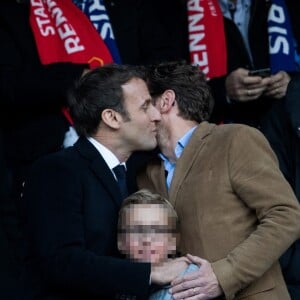 Le président Emmanuel Macron avec son frère Laurent Macron et ses neveux Louis et Paul-Arthur Macron lors de la victoire du Stade Rennais (2-2, 6-5 aux t.a.b.) en finale de la Coupe de France contre le PSG le 27 avril 2019 au Stade de France.