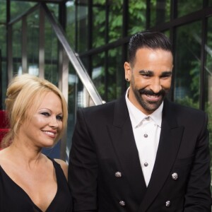 Adil Rami et sa compagne Pamela Anderson arrivent à la 28ème cérémonie des trophées UNFP (Union nationale des footballeurs professionnels) au Pavillon d'Armenonville à Paris, France, le 19 mai 2019.