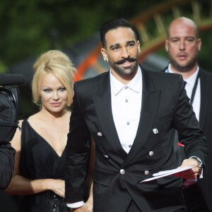 Adil Rami et sa compagne Pamela Anderson arrivent à la 28ème cérémonie des trophées UNFP (Union nationale des footballeurs professionnels) au Pavillon d'Armenonville à Paris, France, le 19 mai 2019.