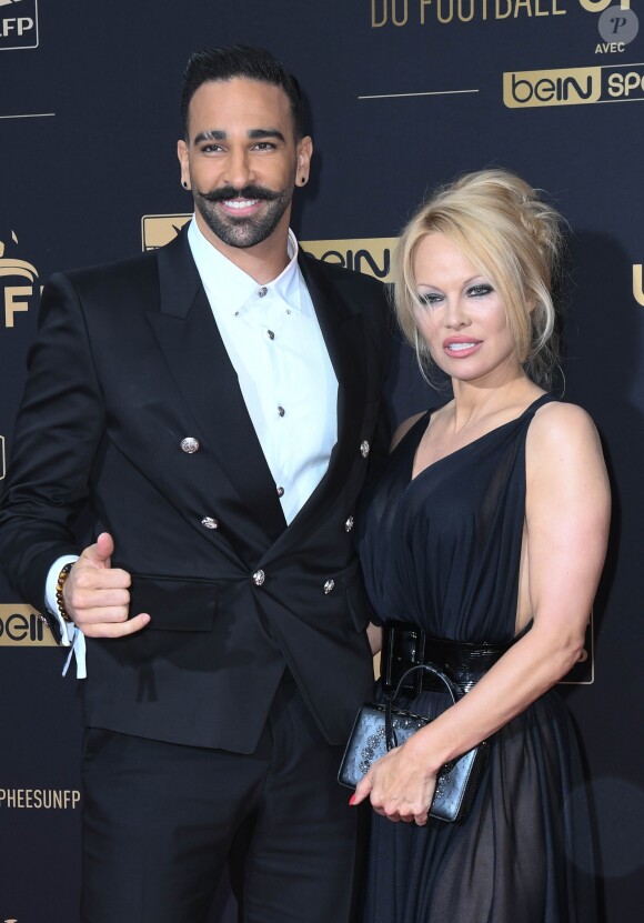 Adil Rami et sa compagne Pamela Anderson au photocall de la 28ème cérémonie des trophées UNFP (Union nationale des footballeurs professionnels) au Pavillon d'Armenonville à Paris, France, le 19 mai 2019. © Coadic Guirec/Bestimage