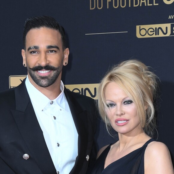 Adil Rami et sa compagne Pamela Anderson au photocall de la 28ème cérémonie des trophées UNFP (Union nationale des footballeurs professionnels) au Pavillon d'Armenonville à Paris, France, le 19 mai 2019. © Coadic Guirec/Bestimage