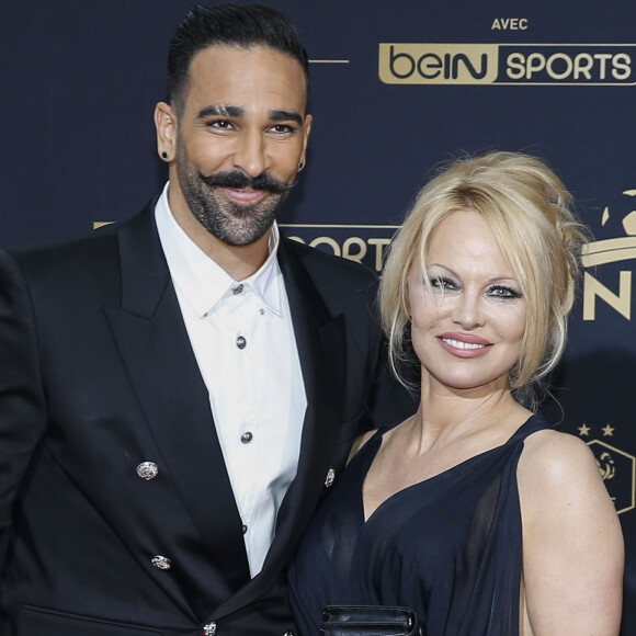 Adil Rami et Pamela Anderson au photocall de la 28ème cérémonie des trophées UNFP (Union nationale des footballeurs professionnels) au Pavillon d'Armenonville à Paris, France, le 19 mai 2019.