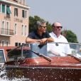 George Clooney et sa femme Amal Clooney sortent de leur hôtel, et prennent un bateau taxi pour se rendre dans un héliport pour s'envoler en hélicoptère de Venise, Italie, le 27 juin 2019.