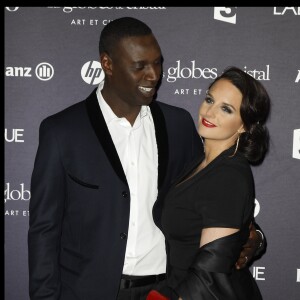 Omar et hélène Sy soirée des Globes de Cristal au Lido à Paris, le 6 février 2012.