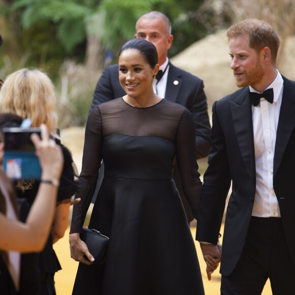 Le prince Harry, duc de Sussex, et Meghan Markle, duchesse de Sussex, à la première du film "Le Roi Lion" au cinéma Odeon Luxe Leicester Square à Londres, le 14 juillet 2019.