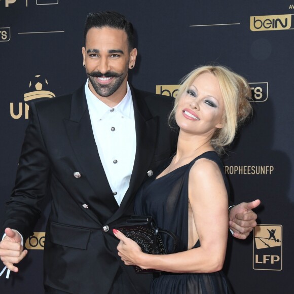 Adil Rami et Pamela Anderson au photocall de la 28ème cérémonie des trophées UNFP (Union nationale des footballeurs professionnels) au Pavillon d'Armenonville à Paris, France, le 19 mai 2019. © Coadic Guirec/Bestimage