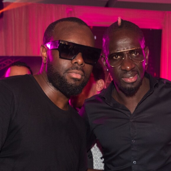 Le rappeur Gims (Maître Gims - Gandhi Djuna), Mamadou Sakho et sa femme Majda lors de la 14ème édition du Casa Fashion Show au Sofitel Casablanca Tour Blanche à Casablanca, Maroc, le 20 avril 2019. Sept ans déjà que le Casa Fashion Show promeut la femme marocaine citoyenne du monde. Devenu un rendez-vous incontournable et placé sous le Haut Patronage de Sa Majesté le Roi du Maroc, l'événement porté par K.Cheddadi et chorégraphié par H.Ghorab, se veut le reflet d'une société plurielle et avant-gardiste, jonglant avec brio entre ses racines orientales et sa culture occidentale. Une société solidaire également... L'événement soutenant depuis son lancement l'Association des Bonnes Œuvres du Coeur dont l'objectif est de redonner un souffle de vie et d'espoir aux bébés bleus. Le Casa Fashion Show dévoile au public marocain les collections Printemps/Eté 2019 des griffes les plus prestigieuses : de Etro à Oud Paris, en passant par Elisabetta Franchi, Pinko, Dice Kayek, Just Cavalli ou encore Orza Couture... Les créateurs marocains Lina Cahill et Sara Chraibi revisitent la robe du soir, avec cet oeil aiguisé et ce sens pointu du détail qui les caractérisent. Le talentueux couturier tunisien, Ali Karoui (souvent surnommé le nouveau Azzedine Alaia), est présent pour la seconde fois consécutive. Enfin, l'enseigne marocaine de luxe IO sera la chaussure officielle de l'événement et l'Oréal Paris, le partenaire coiffure et make up du show. © Philippe Doignon/Bestimage