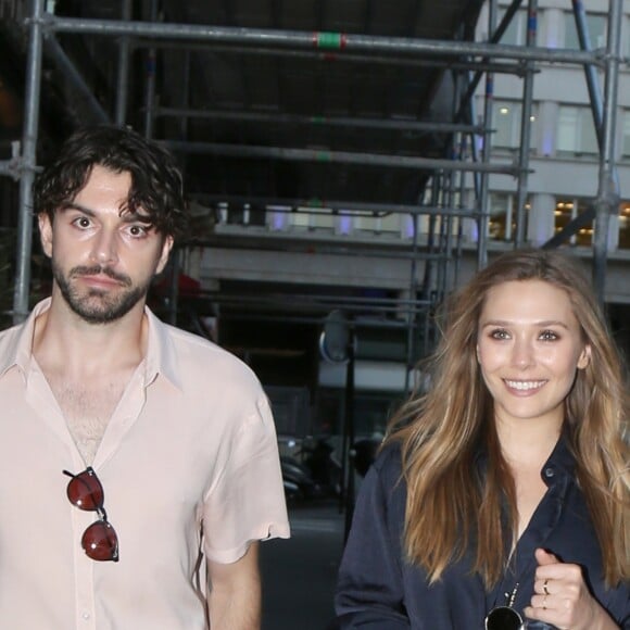 Elizabeth Olsen et son compagnon Robbie Arnett - Dîner "The Row" organisé par les soeurs Olsen chez Caviar Kaspia à Paris le 3 juillet 2017.