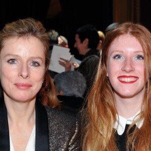 Karin Viard et sa fille ainée Marguerite - People au défilé de mode Lanvin prêt-à-porter collection Automne/Hiver 2014-2015 lors de la fashion week à Paris, le 27 février 2014.
