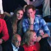 Sam Branson, le prince Harry d'Angleterre, sa compagne Cressida Bonas, Holly Branson et son mari Fred Andrews dans les tribunes du stade de Wembley lors de l'évènement "We Day UK" à Londres. Le 7 mars 2014