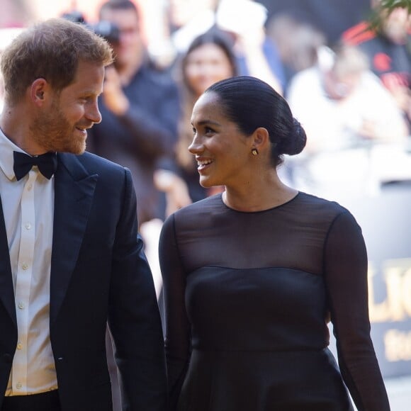 Le prince Harry, duc de Sussex, et Meghan Markle, duchesse de Sussex, à la première du film "Le Roi Lion" au cinéma Odeon Luxe Leicester Square à Londres, le 14 juillet 2019.