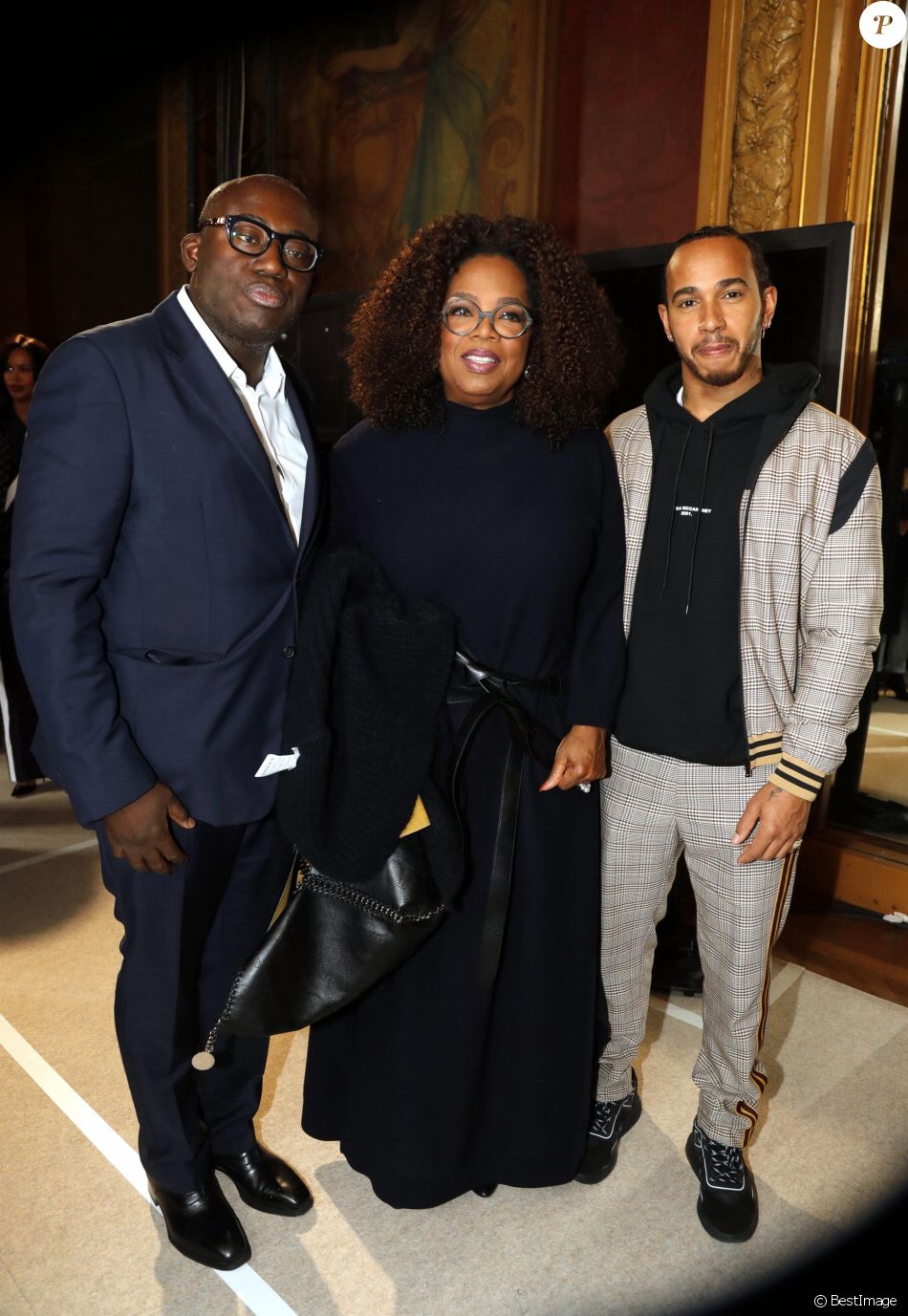 Edward Enninful, Oprah Winfrey et Lewis Hamilton au défilé Stella McCartney lors de la Fashion Week à Paris, le 4 mars 2019.