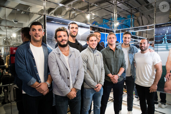 Exclusif - Pierre Fouyssac, Arthur Bonneval, Yoann Maestri, Clément Daguin, Ryan Chapuis, Jules Plisson, Sylvain Nicolas, Jean-Marc Doussain dédicacent le calendrier 2020 des Dieux du Stade aux Galeries Lafayette Champs-Élysées à Paris le 10 octobre 2019.