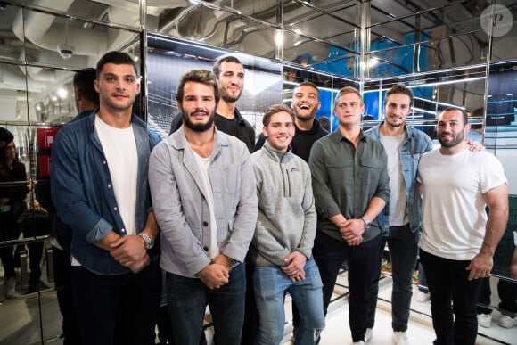 Exclusif - Pierre Fouyssac, Arthur Bonneval, Yoann Maestri, Clément Daguin, Ryan Chapuis, Jules Plisson, Sylvain Nicolas, Jean-Marc Doussain dédicacent le calendrier 2020 des Dieux du Stade aux Galeries Lafayette Champs-Élysées à Paris le 10 octobre 2019.
