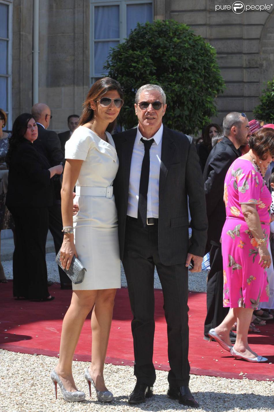 Jean-Claude Darmon et sa femme Hoda Roche, lors de la Garden Party à l'Elysée, le 14 juillet ...