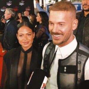 M. Pokora et Christina Milian avant de monter les marches du Palais des Festivals et des Congrès de Cannes pour la 21e cérémonie des NRJ Music Awards, le 9 novembre 2019.