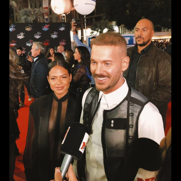 M. Pokora et Christina Milian avant de monter les marches du Palais des Festivals et des Congrès de Cannes pour la 21e cérémonie des NRJ Music Awards, le 9 novembre 2019.